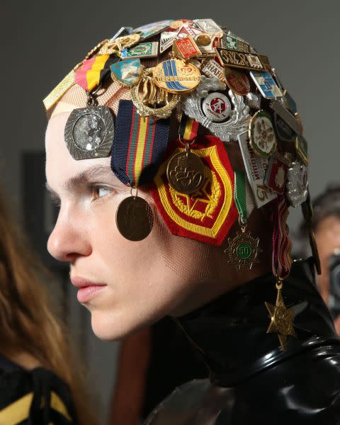 <p>Channel the spooky magical suits of armour from Bedknobs And Broomsticks by covering your entire head in old medals.</p>