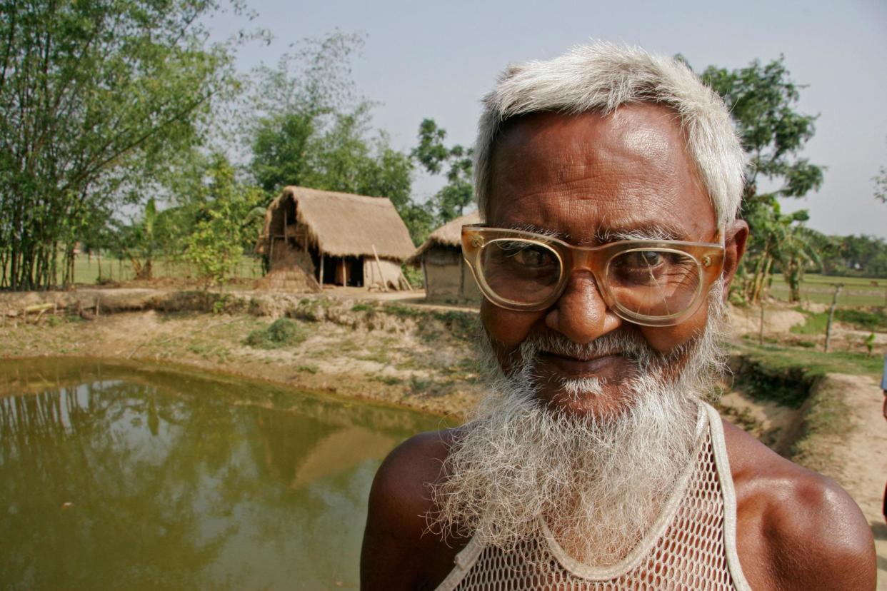 <span>A farmer in Bangladesh. The study found glasses made daily tasks such as reading a phone screen or cooking easier. </span><span>Photograph: Sean Sprague/Alamy</span>