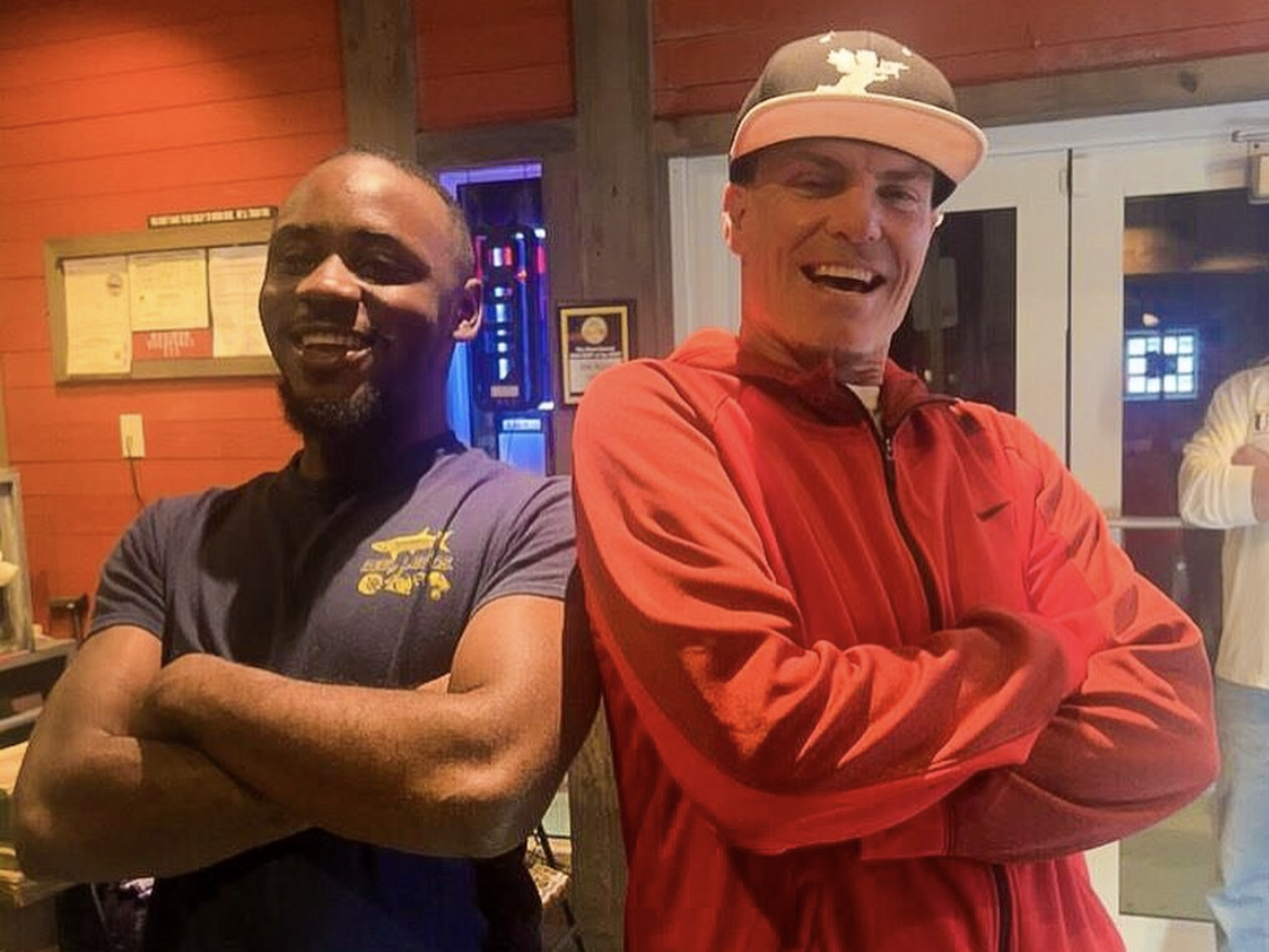 Tavage, a cook at Funky Pelican in Flagler Beach, poses alongside rap star Vanilla Ice during the celebrity's recent visit to the restaurant.