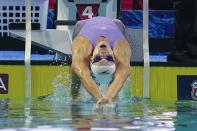 Regan Smith starts on her way to winning the women's 100-meter backstroke at the U.S. nationals swimming meet, Friday, June 30, 2023, in Indianapolis. (AP Photo/Darron Cummings)