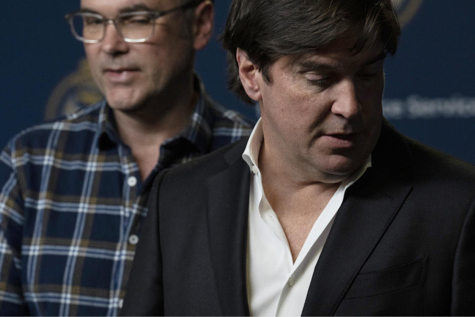 Sean McCowan, right, stands with Kaelin McCowan, brothers of Erin Gilmour, during a press conference in Toronto, on Monday, Nov. 28, 2022. Toronto police say they've arrested a 61-year-old man in the DNA-linked cold-case murders of Gilmour and Susan Tice, who were found dead in their homes within months of each other almost four decades ago. (Chris Young/The Canadian Press via AP)