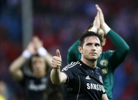 Chelsea's Frank Lampard acknowledges crowd at end of his team's Champion's League semi-final first leg soccer match against Atletico Madrid at Vicente Calderon stadium in Madrid, April 22, 2014 file photo. REUTERS/Darren Staples