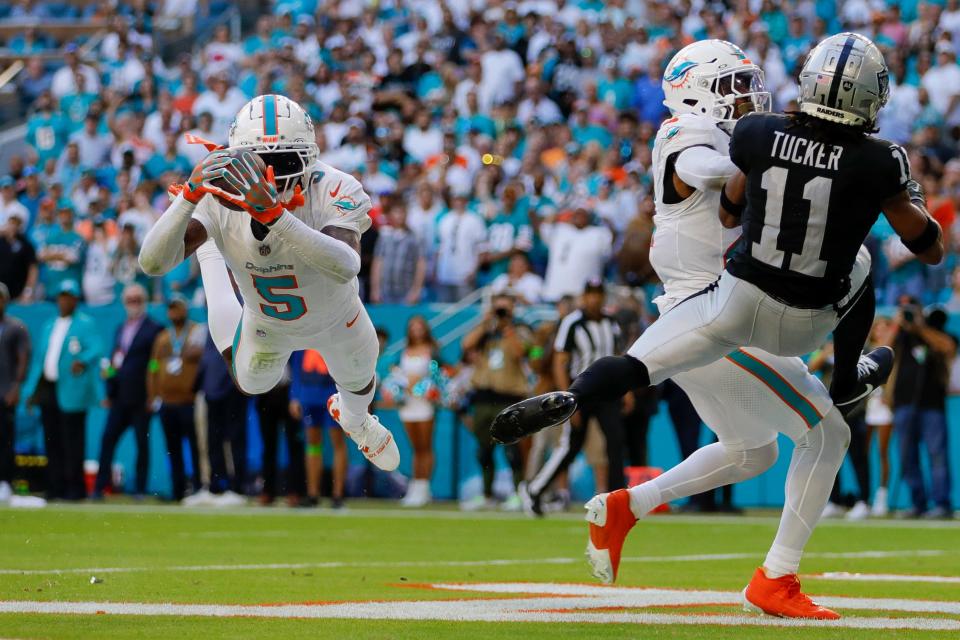 Nov 19, 2023; Miami Gardens, Florida, USA; Miami Dolphins cornerback Jalen Ramsey (5) intercepts a pass intended to Las Vegas Raiders wide receiver Tre Tucker (11) during the fourth quarter at Hard Rock Stadium. Mandatory Credit: Sam Navarro-USA TODAY Sports