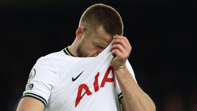 Spurs defender Eric Dier wipes his face with his shirt Credit: Alamy