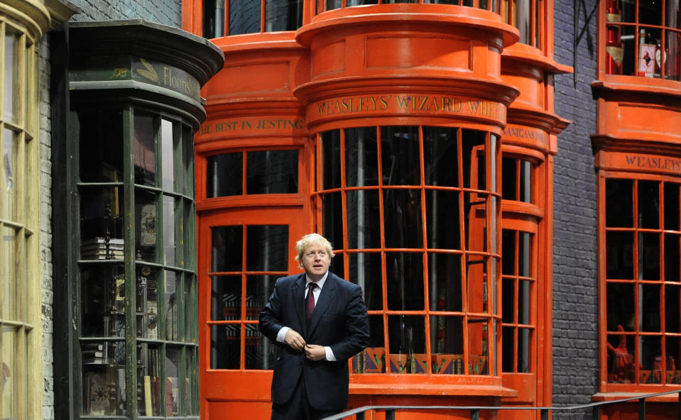 Mayor of London Boris Johnson walks down Diagon Alley as he visits the new attraction 'The Making of Harry Potter' at Warner Brothers studios in Leavesden, Hertfordshire. PRESS ASSOCIATION Photo Monday December 19, 2011. Photo credit should read: Anthony Devlin/PA Wire