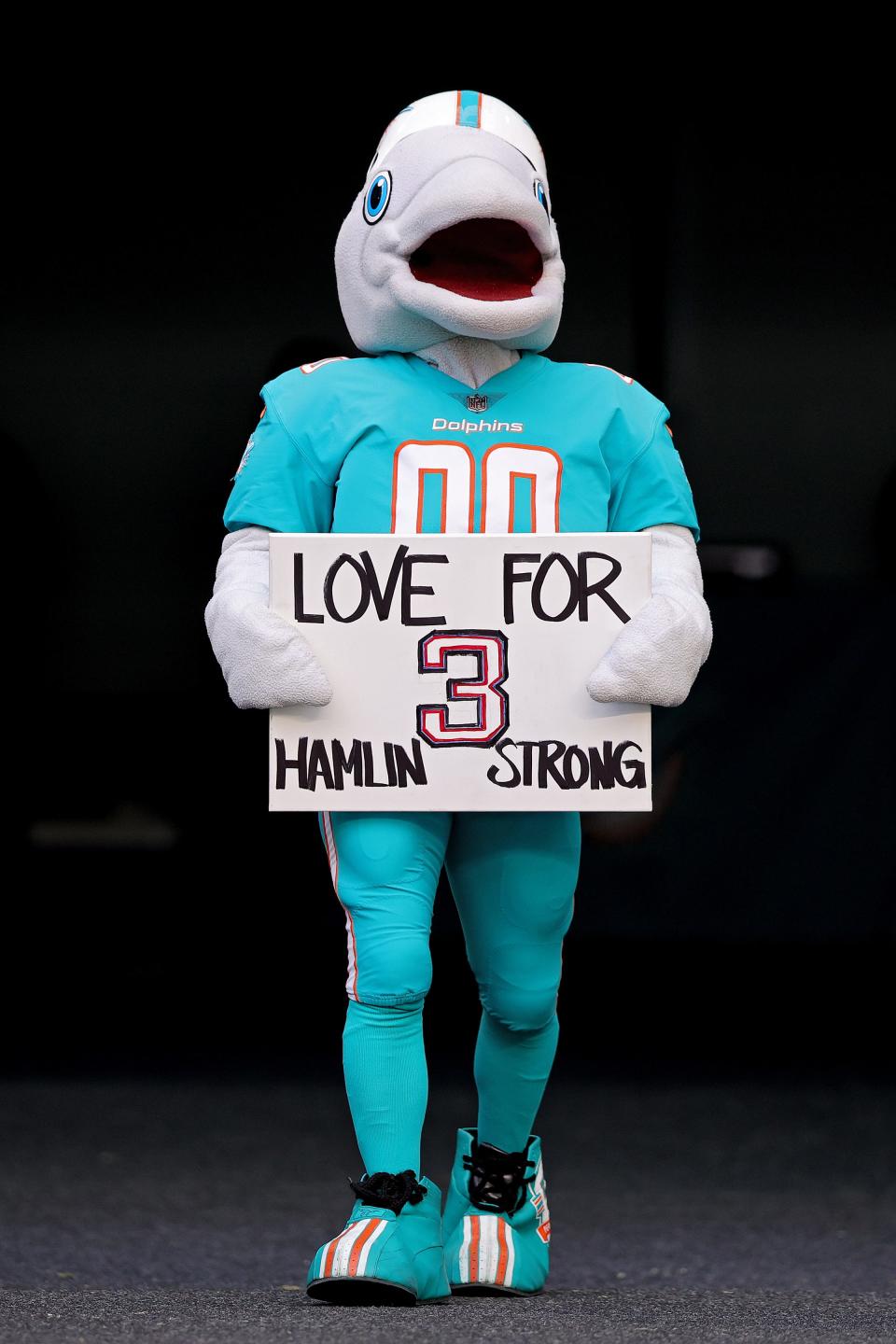 Miami Dolphins mascot T.D holds a sign in support of Buffalo Bills safety Damar Hamlin during a game against the New York Jets