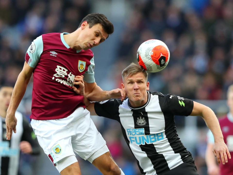 Jack Cork and Matt Ritchie compete in the air: Getty