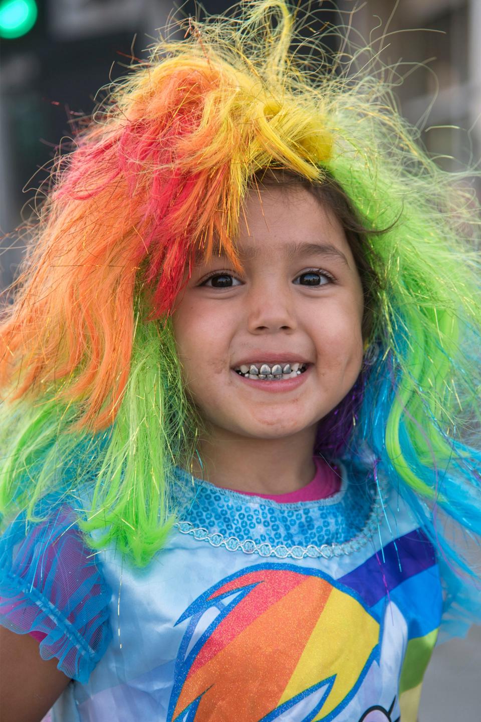 Five-year-old Alexis Barrera dressed in My Little Pony colors during the annual Trick or Treat on the Mile event along Pacific Avenue on the Miracle Mile in Stockton. This is an example of a rainbow of colors making a photo eye-catching.