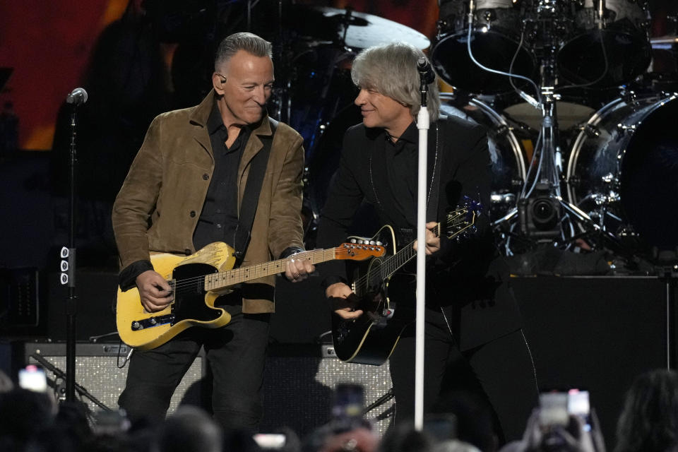 Bruce Springsteen, left, and Jon Bon Jovi perform during MusiCares Person of the Year honoring Jon Bon Jovi on Friday, Feb. 2, 2024, in Los Angeles. (AP Photo/Chris Pizzello)