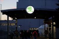 Workers enter Skoda Auto's factory as the company restarts production after shutting down last month due to the coronavirus disease (COVID-19) outbreak in Mlada Boleslav