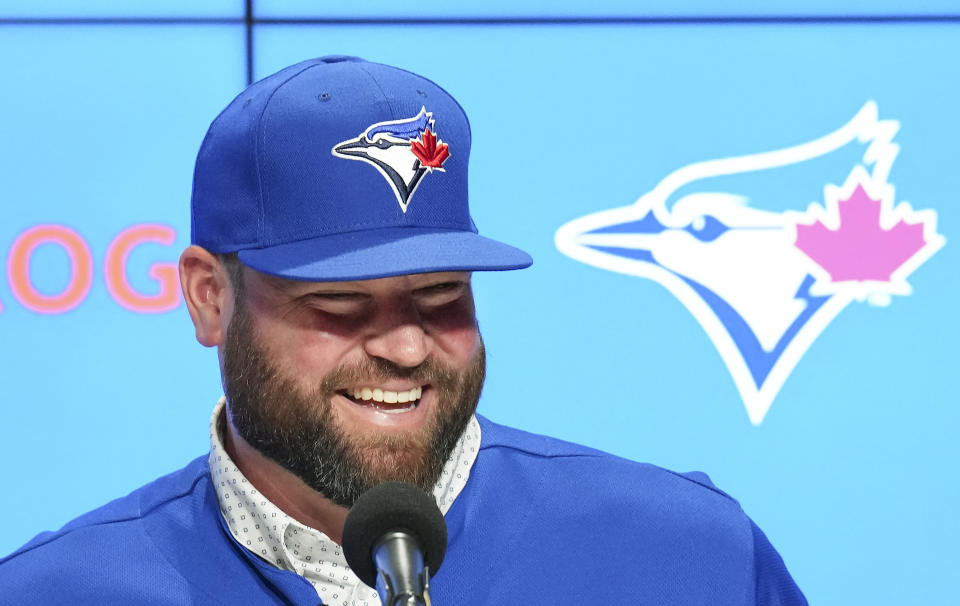 Toronto Blue Jays manager John Schneider smiles during a press conference in Toronto on Friday, Oct. 21, 2022. The Toronto Blue Jays and manager John Schneider have agreed to terms on a three-year contract with a team option for the 2026 season, the club announced Friday. (Nathan Denette/The Canadian Press via AP)