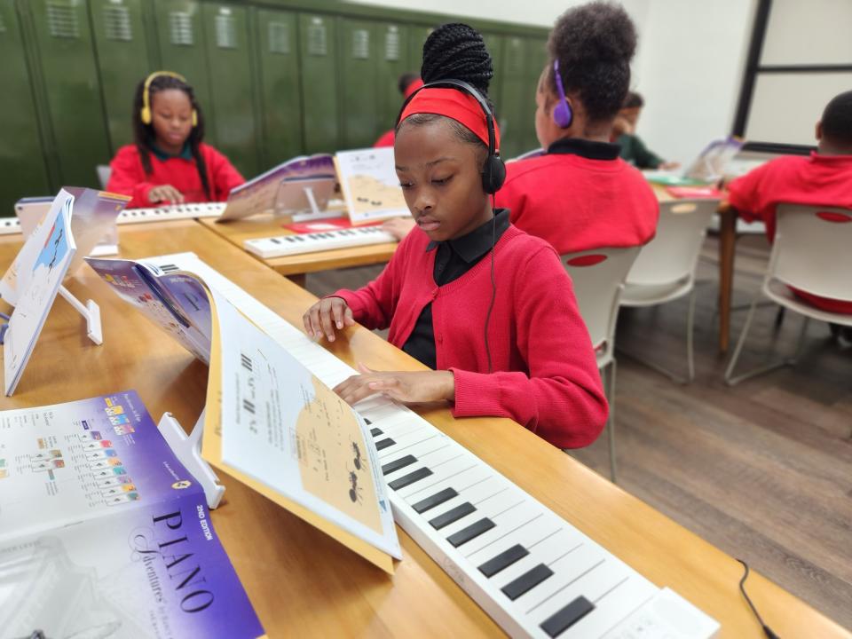 A student at Sister Thea Bowman Catholic School participates in Pianos for People, one of Access Academies’ enrichment offerings. (Access Academies)