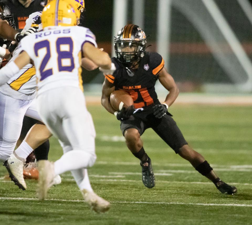 Harlem sophomore Jahmani Muhammad, shown running against Hononegah on Sept. 2, is second in the NIC-10 with 940 rushing yards after Week 8.