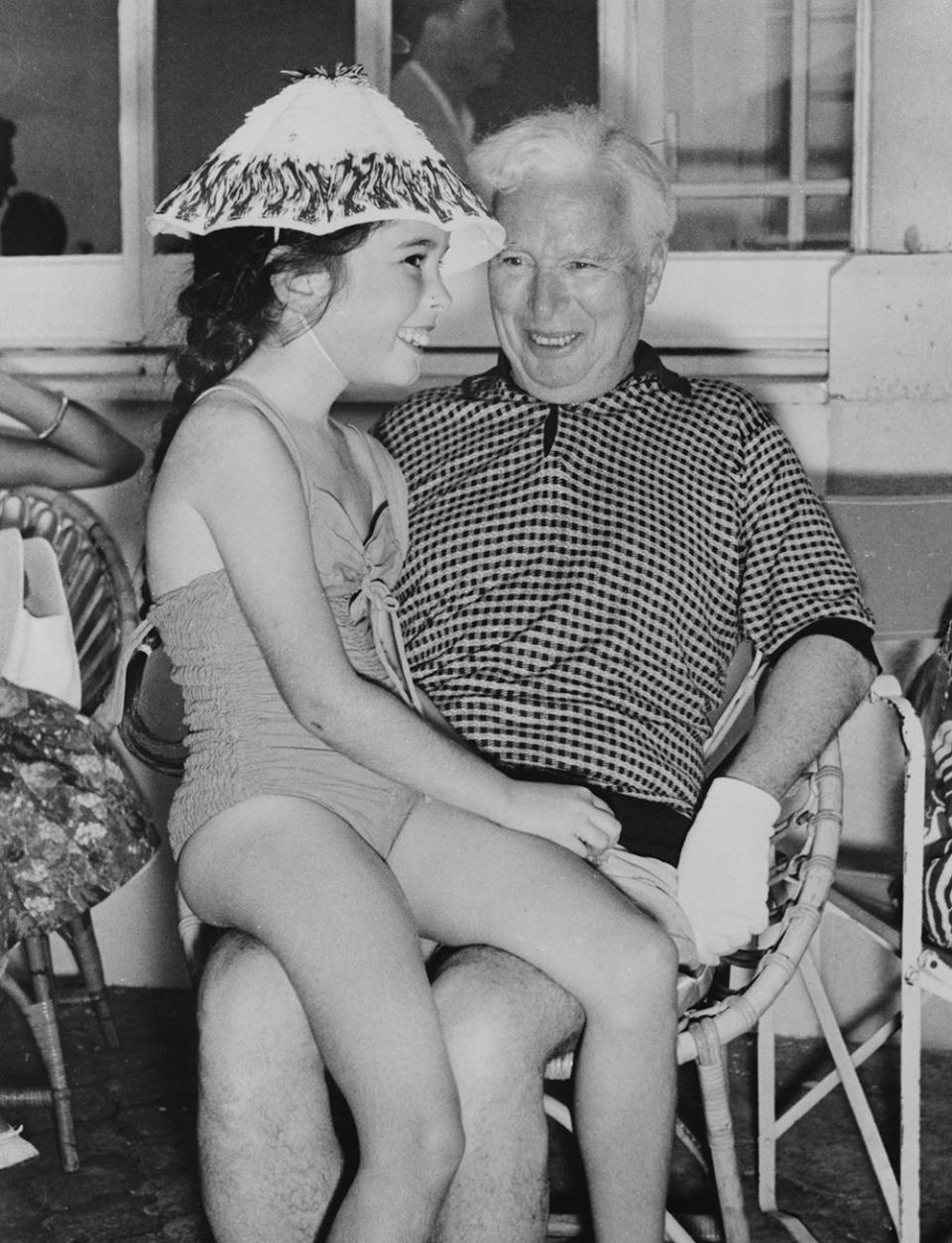 English actor and filmmaker Charlie Chaplin with his daughter Josephine during a summer vacation at their villa in Saint-Jean-Cap Ferrat, southeastern France, 15th July 1957.