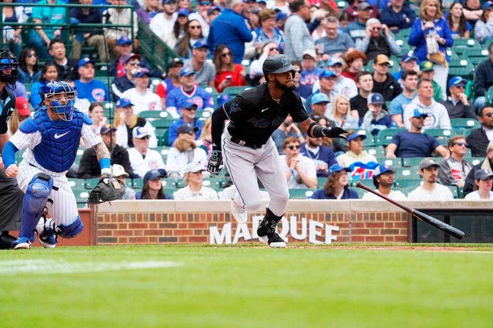 Miami Marlins left fielder Bryan De La Cruz (14) hits an RBI single against the Chicago Cubs during the first inning at Wrigley Field on Saturday, May 6, 2023.