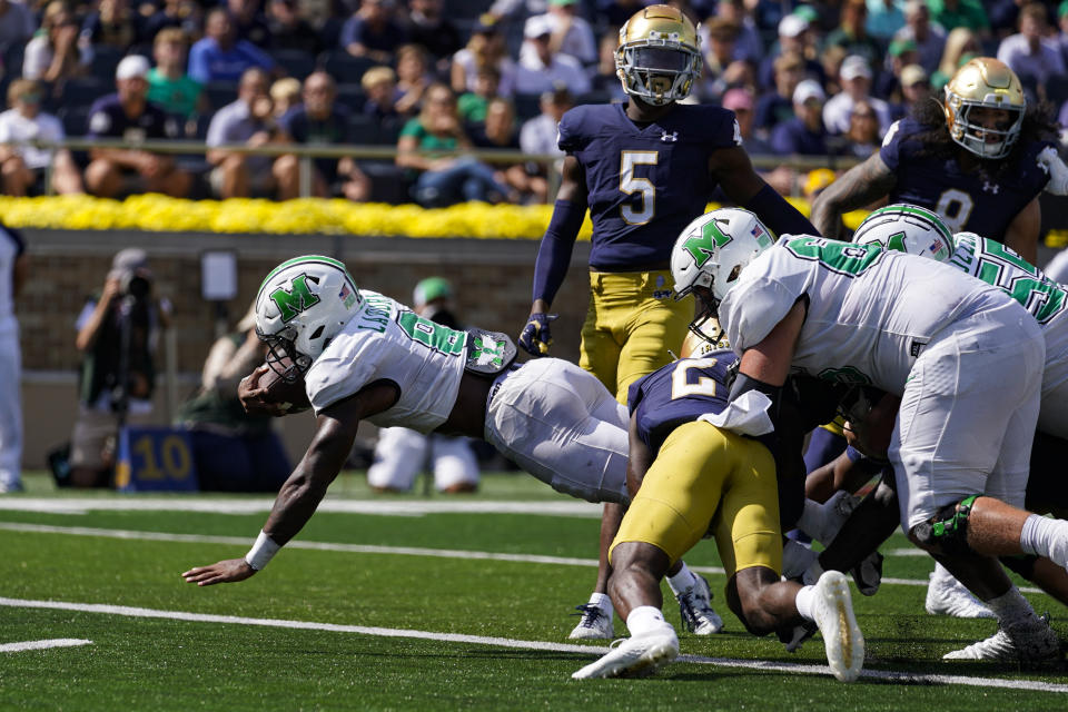 Marshall running back Khalan Laborn dives in for a touchdown against Notre Dame during the first half of an NCAA college football game in South Bend, Ind., Saturday, Sept. 10, 2022. (AP Photo/Michael Conroy)