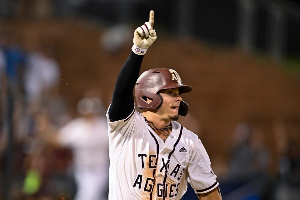 Jun 10, 2022; College Station, TX, USA; Texas A&M catcher Troy Claunch (12) reacts after hitting a walk-off RBI single in the ninth against Louisville in game one of the super regional. Mandatory Credit: Maria Lysaker-USA TODAY Sports