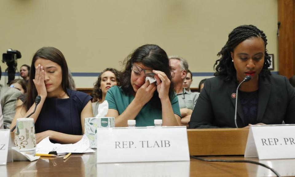 Rashida Tlaib, center, wipes her eyes after testifying before the House oversight committee hearing on family separation and detention centers.