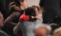 NEWTOWN, CT - DECEMBER 16: Mourners comfort one another before U.S. President Barack Obama speaks at an interfaith vigil for the shooting victims from Sandy Hook Elementary School on December 16, 2012 at Newtown High School in Newtown, Connecticut. Twenty-six people were shot dead, including twenty children, after a gunman identified as Adam Lanza opened fire at Sandy Hook Elementary School. Lanza also reportedly had committed suicide at the scene. A 28th person, believed to be Nancy Lanza, found dead in a house in town, was also believed to have been shot by Adam Lanza. (Photo by Olivier Douliery-Pool/Getty Images)