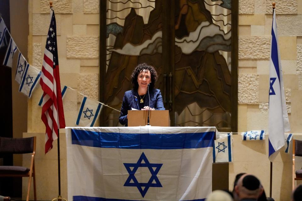 Danielle V. Minson, CEO of the Jewish Federation of Cincinnati, gives a speech during the Community Solidarity Gathering for Israel event at Adath Israel Congregation in Amberley, Ohio, Tuesday, Oct. 10, 2023. Hundreds of people gathered in the synagogue Tuesday night to express solidarity with Israel, including Cincinnati Mayor Aftab Pureval, Ohio Rep. Sara Carruthers, Holocaust survivor Zahava Rendler and many leaders from the Cincinnati Jewish community.