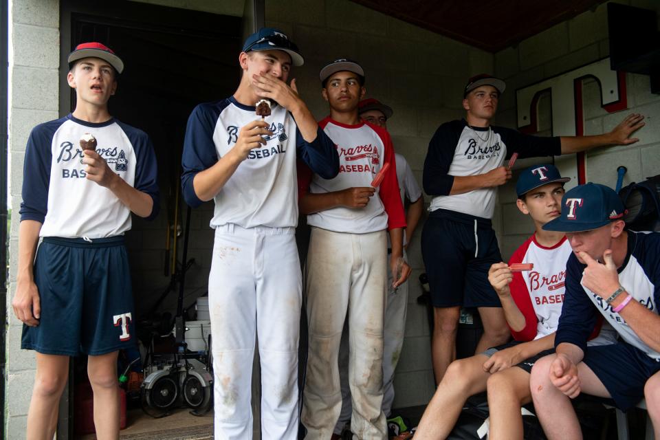 Tecumseh baseball players eat ice cream after practice Wednesday evening,  June 8, 2022.