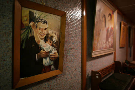 A painting that depicts former Romanian communist dictator Nicolae Ceausescu hangs on a wall in one of the hallways that lead to the bunker of Romania's former communist dictator Nicolae Ceausescu in Bucharest, Romania, January 25, 2017.. Inquam Photos/Octav Ganea/via REUTERS