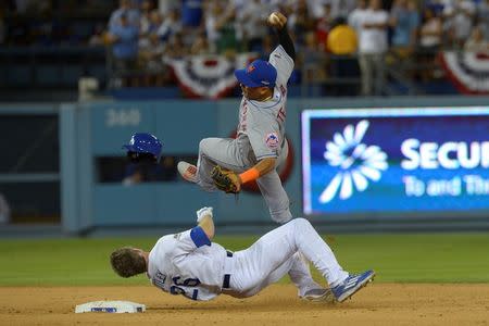 Oct 10, 2015; Los Angeles, CA, USA; New York Mets shortstop Ruben Tejada (11) collides with Los Angeles Dodgers second baseman Chase Utley (26) at second base during the seventh inning in game two of the NLDS at Dodger Stadium. Mandatory Credit: Jayne Kamin-Oncea-USA TODAY Sports