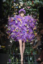 <p><i>Purple feather ball and butterfly appliqués from the SS18 Moschino collection. (Photo: ImaxTree) </i></p>