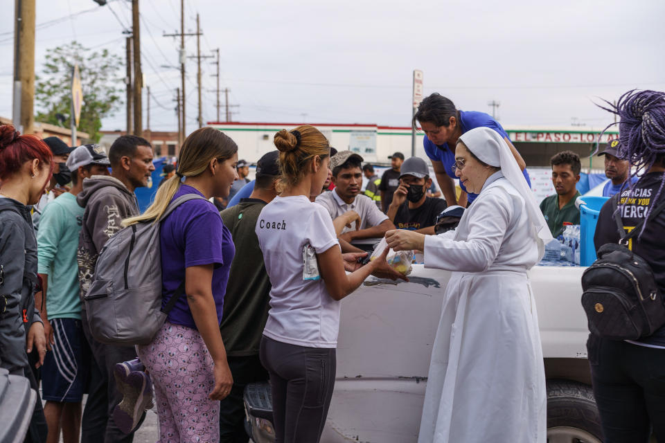 Migrants wait in line for donations outside of Sacred Heart Church before the lifting of Title 42 in El Paso, Texas, on May 3, 2023. (Paul Ratje / Bloomberg via Getty Images)