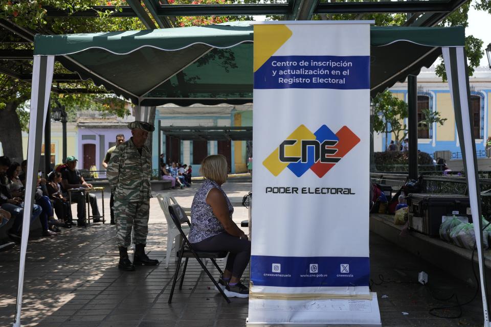 A person registers to vote in the presidential election in Caracas, Venezuela, Tuesday, April 16, 2024. Voters go to the polls on July 28th. (AP Photo/Ariana Cubillos)