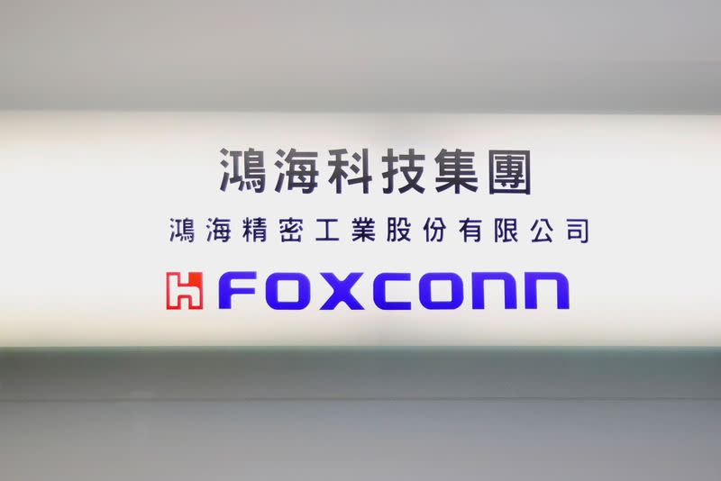 FILE PHOTO: A Foxconn sign is seen on a glass door inside its office building in Taipei