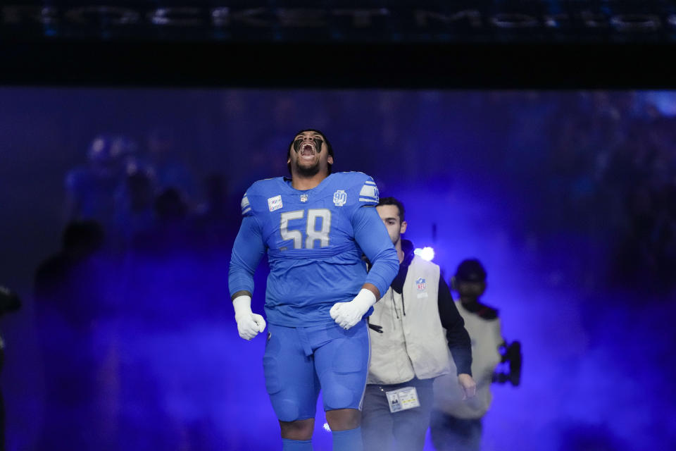 Detroit Lions offensive tackle Penei Sewell (58) reacts to the crowd as he runs on the field during player introductions before an NFL football game against the Carolina Panthers in Detroit, Sunday, Oct. 8, 2023. (AP Photo/Paul Sancya)