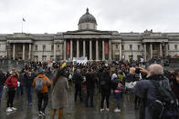 Protestors gather in Trafalgar Square, during a coronavirus anti-lockdown protest, in London, Saturday, Oct. 24, 2020. (AP Photo/Alberto Pezzali)