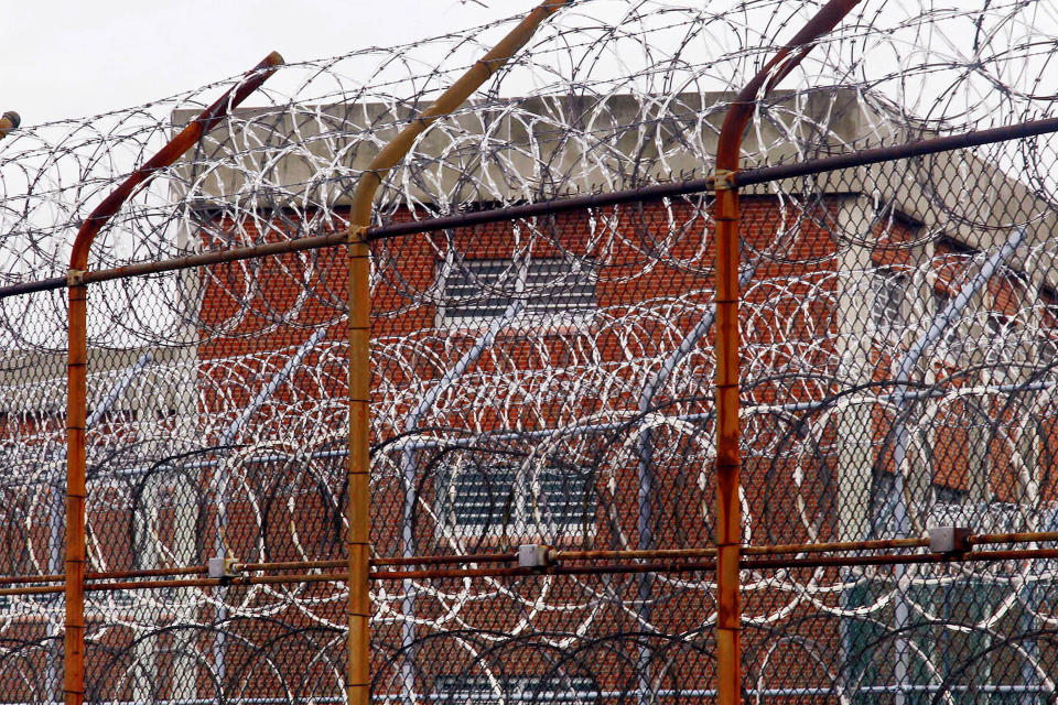 In this March 16, 2011, file photo, a security fence surrounds inmate housing on the Rikers Island correctional facility in New York. (Photo: Bebeto Matthews/AP)