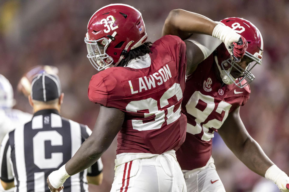 Alabama linebacker Deontae Lawson (32) and defensive lineman Justin Eboigbe (92) celebrate a stop against Middle Tennessee during the first half an NCAA college football game Saturday, Sept. 2, 2023, in Tuscaloosa, Ala. (AP Photo/Vasha Hunt)