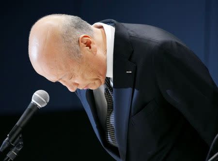 Tadashi Ishii, president of Japan's top advertising agency Dentsu Inc, bows during a news conference in Tokyo, Japan, in this photo taken by Kyodo December 28, 2016. Mandatory credit Kyodo/via REUTERS