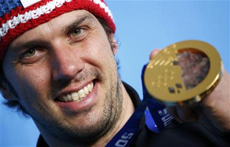 Austria's Mario Matt poses with his gold medal after the men's alpine skiing slalom event during the 2014 Sochi Winter Olympics at the Rosa Khutor Alpine Center February 22, 2014. REUTERS/Dominic Ebenbichler