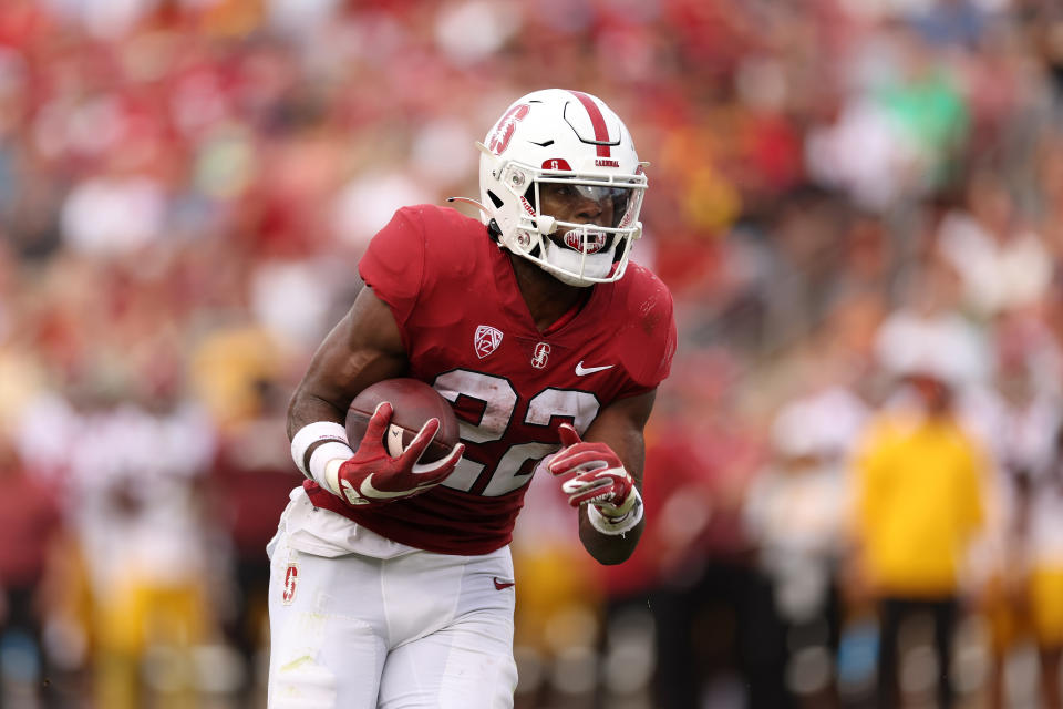 STANFORD, CALIFORNIA – SEPTEMBER 10: E.J. Smith #22 of the <a class="link " href="https://sports.yahoo.com/ncaaw/teams/stanford/" data-i13n="sec:content-canvas;subsec:anchor_text;elm:context_link" data-ylk="slk:Stanford Cardinal;sec:content-canvas;subsec:anchor_text;elm:context_link;itc:0">Stanford Cardinal</a> in action against the <a class="link " href="https://sports.yahoo.com/ncaaw/teams/usc/" data-i13n="sec:content-canvas;subsec:anchor_text;elm:context_link" data-ylk="slk:USC Trojans;sec:content-canvas;subsec:anchor_text;elm:context_link;itc:0">USC Trojans</a> at Stanford Stadium on September 10, 2022 in Stanford, California. (Photo by Ezra Shaw/Getty Images)