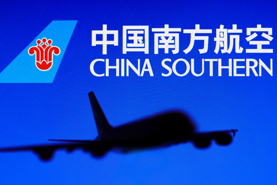 BRAZIL - 2022/05/25: In this photo illustration, the China Southern Airlines logo is seen in the background of a silhouette of an Airbus A380 plane. (Photo Illustration by Rafael Henrique/SOPA Images/LightRocket via Getty Images)