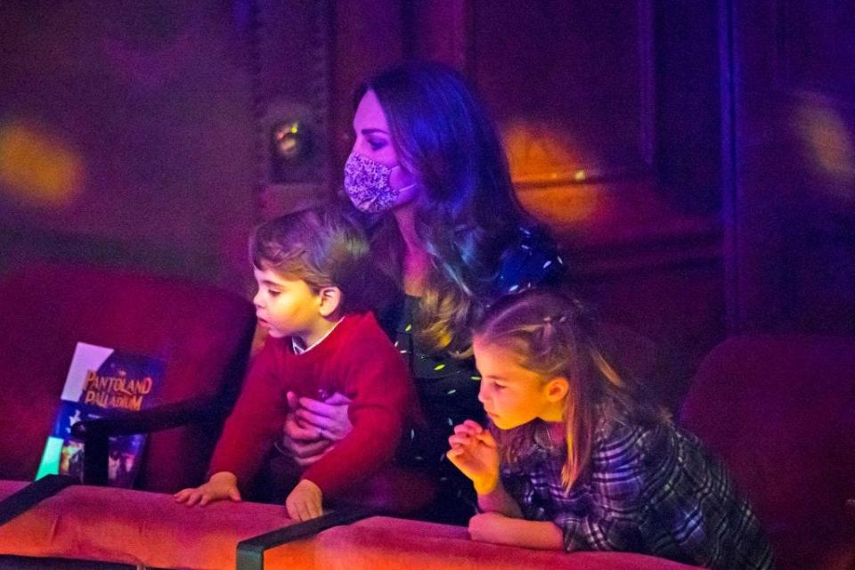 <p>Inside the London Palladium, Louis perched on his mum Kate Middleton's lap while watching the show. Charlotte sat next to her little brother and mum and looked on at the stage animatedly.</p>