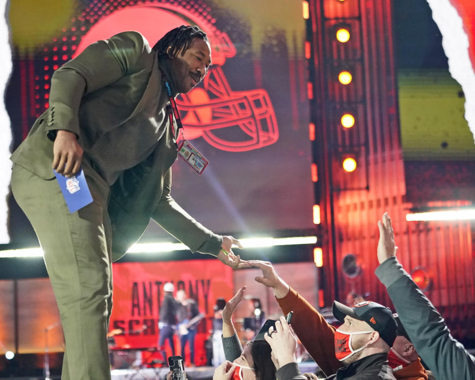 Cleveland Browns' Myles Garrett greets fans during the third round of the NFL football draft Friday, April 30, 2021, in Cleveland. (AP Photo/Tony Dejak)