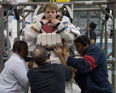 Astronaut Anne McClain (L) is seen during training at the Neutral Buoyancy Laboratory in Houston, Texas, U.S., January 12, 2015. Lauren Harnett/NASA-JSC/Handout via REUTERS