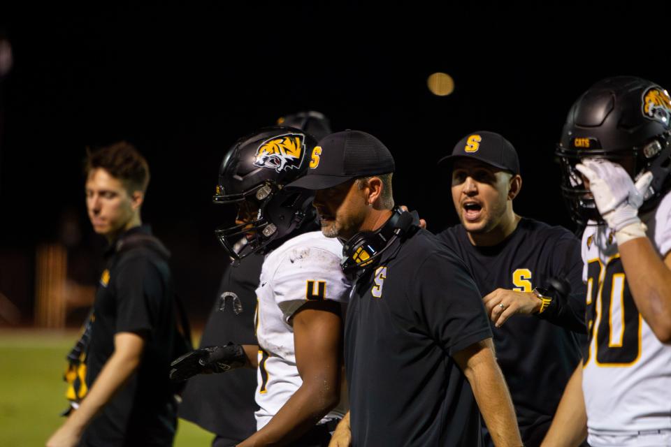 Saguaro head coach Zak Hill walks off the field at Liberty High School in Peoria on Oct. 20, 2023.