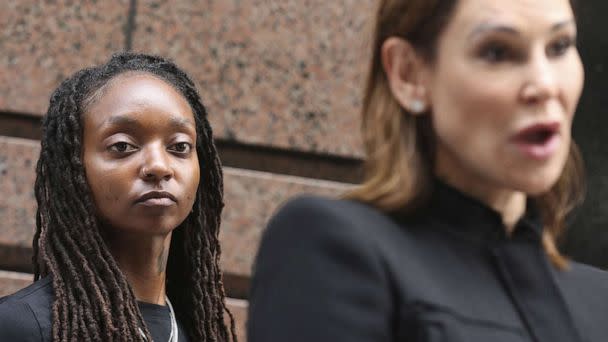 PHOTO: Amazon worker Tori Davis listens during a news conference outside an Amazon Go in Chicago. July 27, 2022. (Chicago Tribune via Getty Images)