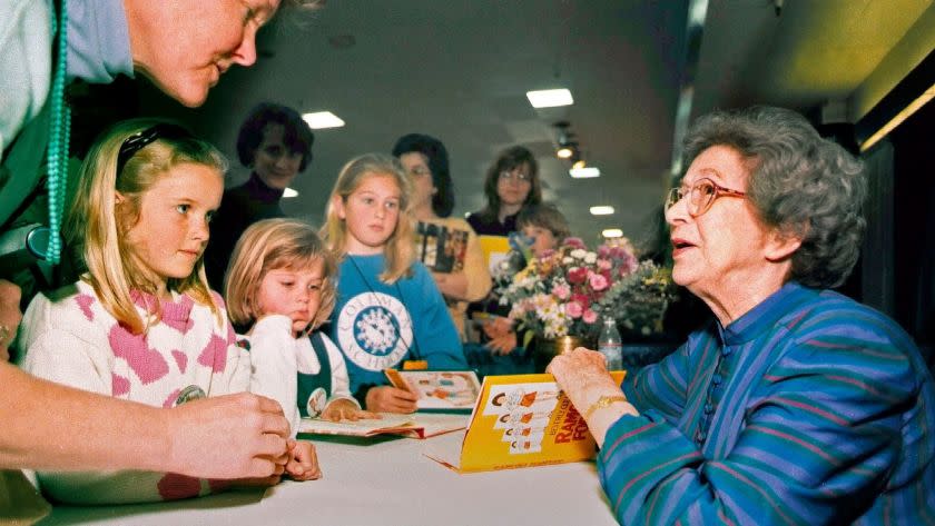 In this April 19, 1998 photo, Beverly Cleary signs books at the Monterey Bay Book Festival in Monterey, Calif. Even as she turns 100, the feisty and witty author, Cleary remembers the Oregon childhood that inspired the likes of characters Ramona and Beezus Quimby and Henry Huggins in the children's books that sold millions and enthralled generations of youngsters. (Vern Fisher/Monterey Herald via AP)