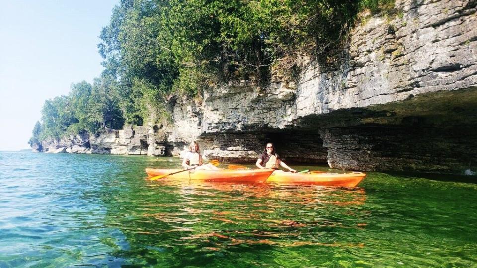 Hug Lake Michigan’s sparkling shoreline in a rental kayak from Peninsula Kayak Co.