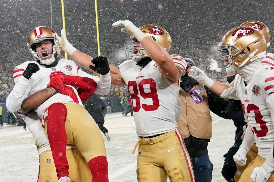 GREEN BAY, WISCONSIN - JANUARY 22: Kicker Robbie Gould #9 of the San Francisco 49ers is congratulated by teammates after kicking the game-winning field goal to win the NFC Divisional Playoff game against the Green Bay Packers. (Photo by Patrick McDermott/Getty Images)