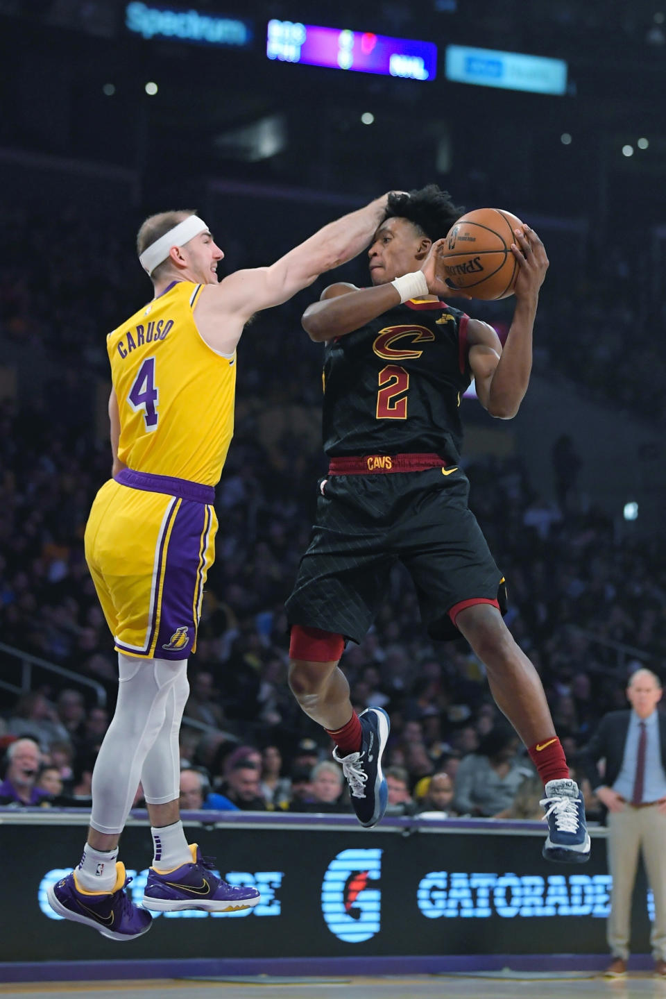 Cleveland Cavaliers guard Kevin Porter Jr., right, shoots as Los Angeles Lakers guard Alex Caruso defends during the first half of an NBA basketball game Monday, Jan. 13, 2020, in Los Angeles. (AP Photo/Mark J. Terrill)