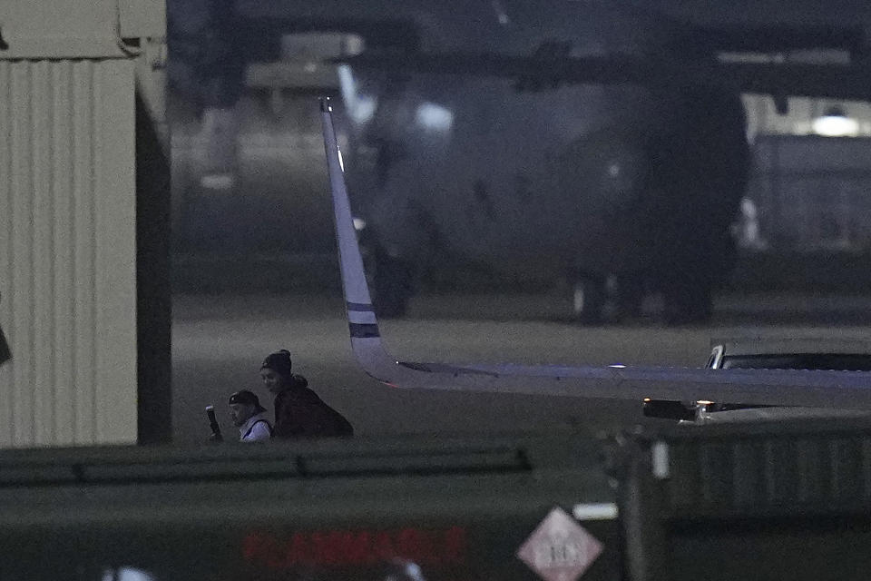 WNBA star Brittney Griner, right, arrives at Kelly Field in San Antonio, Texas, following her release in a prisoner swap with Russia, Friday, Dec. 9, 2022. (AP Photo/Eric Gay)