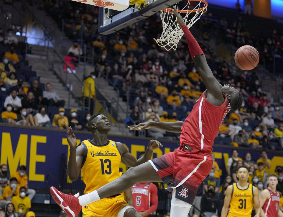 Arizona center Oumar Ballo (11) reacts as he is fouled by California forward Kuany Kuany (13) during the first half of an NCAA college basketball game in Berkeley, Calif., Sunday, Jan. 23, 2022. (AP Photo/Tony Avelar)